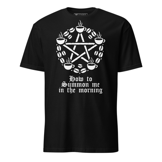 Witches pentagram made of coffee beans and coffee cups with text underneath that says how to summon me in the morning. design is white on a black shirt